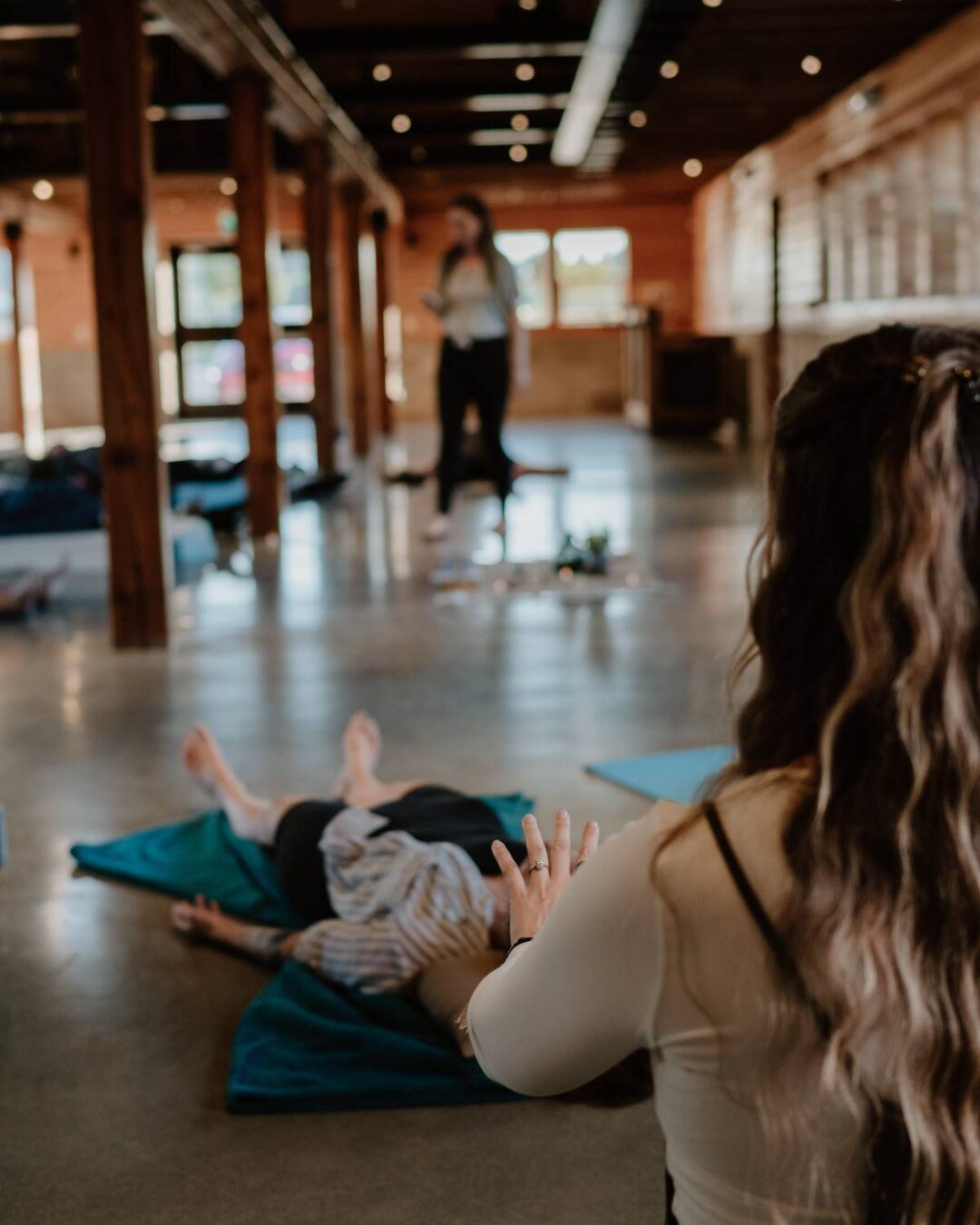 A facilitator guiding participants through a group Ritual Breathwork practice