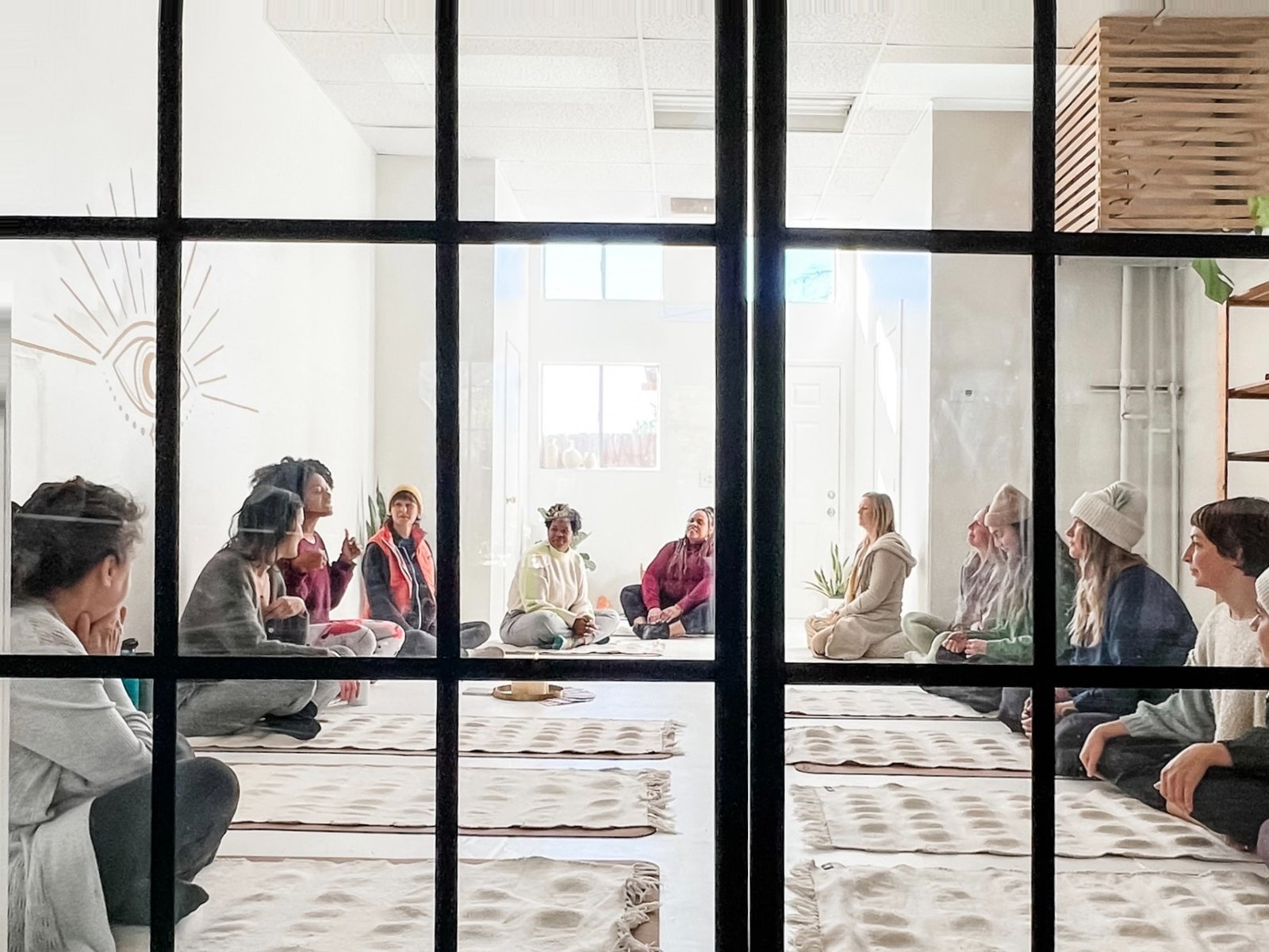 A Ritual Breathwork training class gathered in the studio