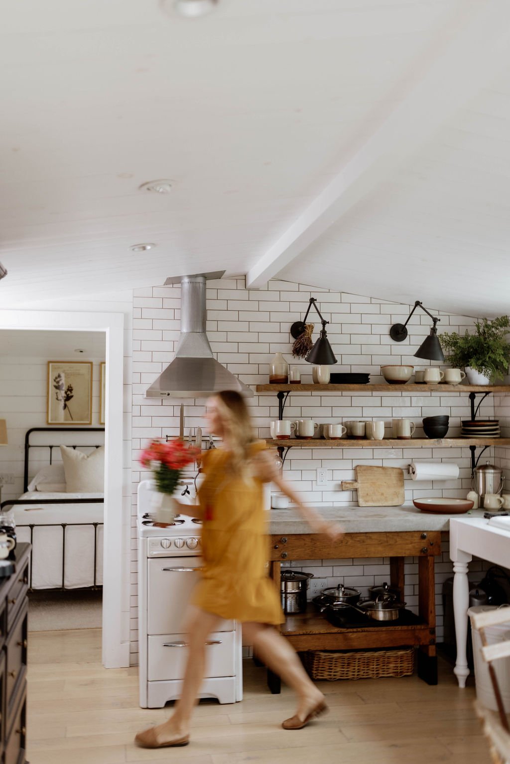 A bright working kitchen filled with handmade ceramics